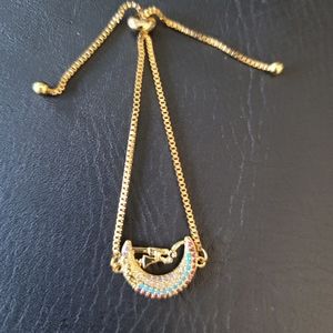 NEW- Half a Moon  gold tone bracelet